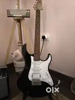 Yamaha pac012 electric guitar with frontman 10g, stand, and cable