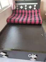 Wooden bed storage with out mattress and table with wheels cost 500