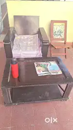 Sofa , centre table and a designer chair