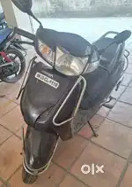 Honda Activa DLX 2012 model + FREE helmet.