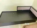 Single bed with storage compartment