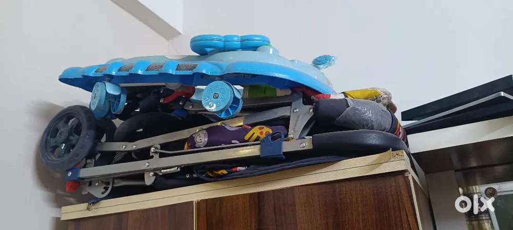 Kids walker and prom...new condition...