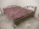 Steel bed with mattress and quilt