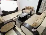 7 seater sofa with table and other items