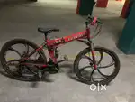 Red Ferrari foldable gear cycle