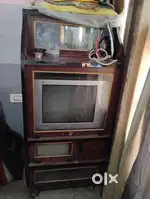 TV 21 inch TCL flat good condition with tv cabinet