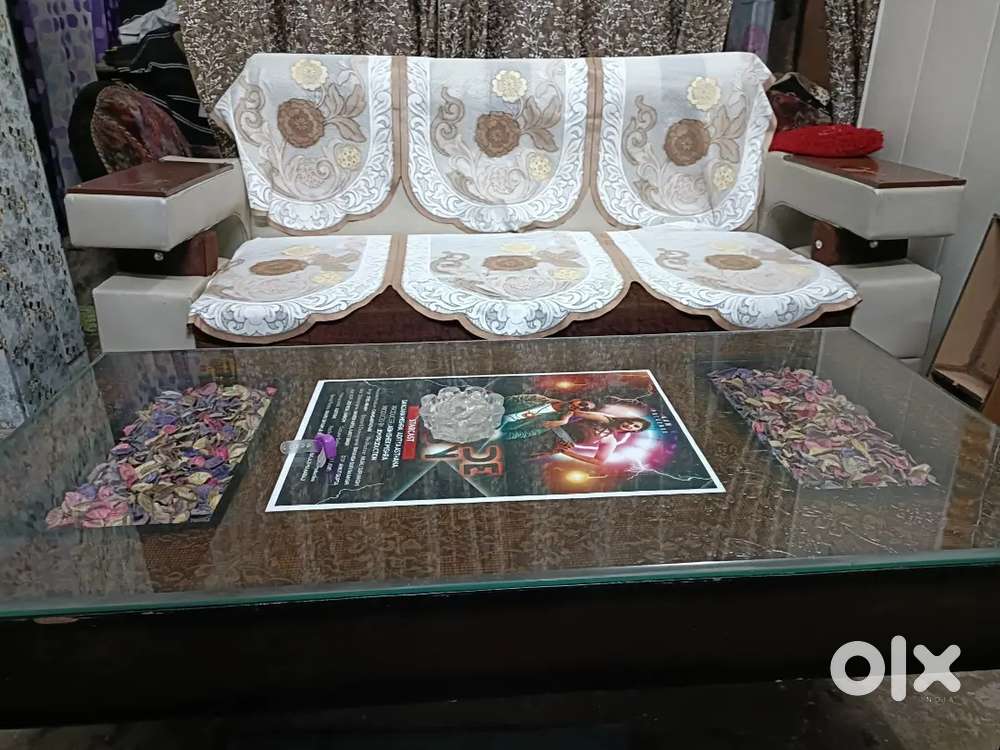 Good condition sofa with classic glass table