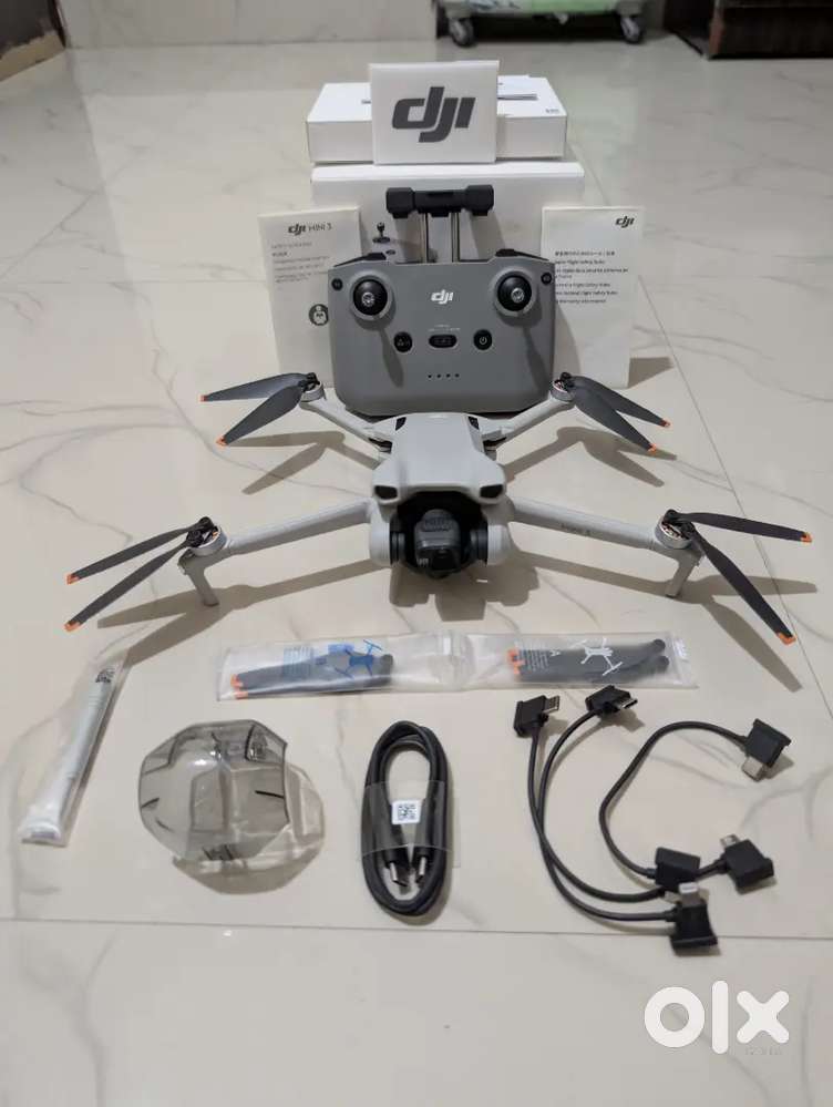 Unboxed DJI Mini 3 with RC-N1 remote and unused accessories with bill
