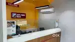 Male / Female EMI counter Staff at Electronic Showrooms