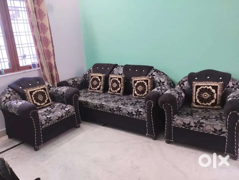 Sofa set with cushions.