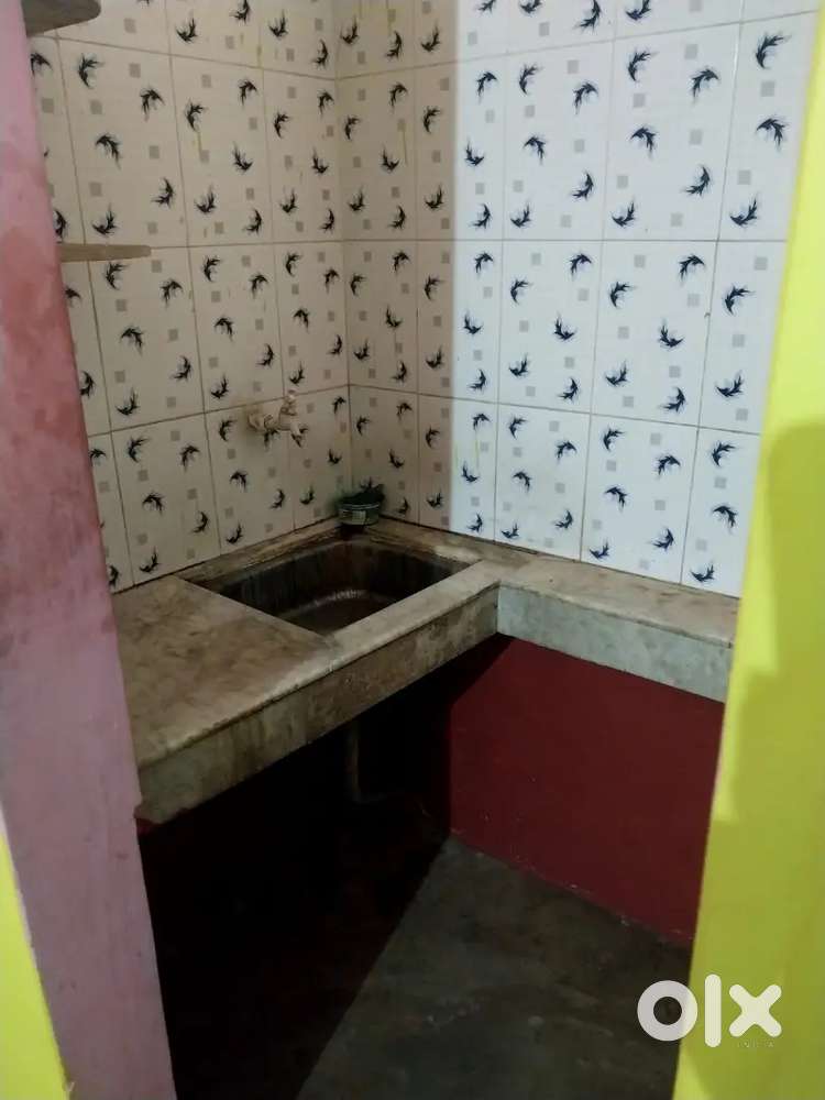 Single room with attached kitchen bath n toilet outside.