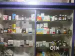 Medical shop furniture with fridge,cctv camera ,printer, and plus sign