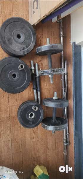 Complete home gym weight set including1. Streight rod with stoppers 5'2. Curled rod with stoppers 3'...