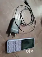 Nokia 130 Keypad Mobile Phone with its Charger