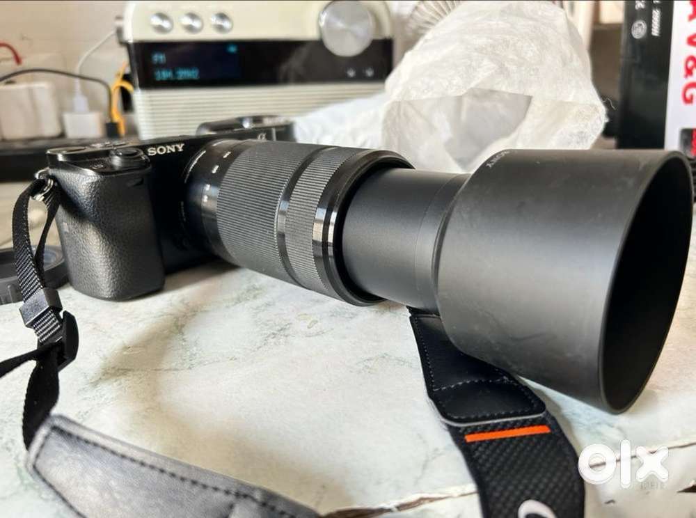 Professional Sony alfa A6000 mirrorless camera with telephoto lens