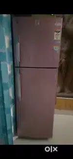 Want to sell   double  door pink color fridge