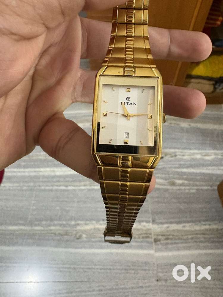 Titan golden couple watch