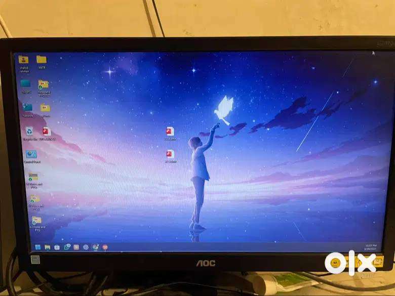 AOC monitor. E2070WHN and a Redgear cloak RGB gaming headphone.