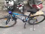 Suncross bicycle with helmet light and horn