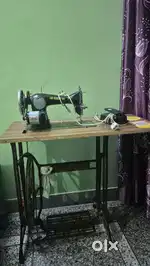 Usha sewing machine with electric motor and table.Good Condition