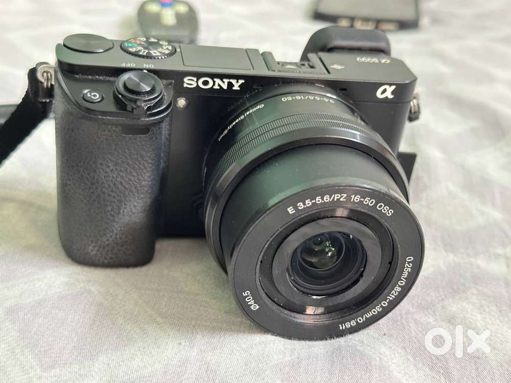 Sony Alpha a6000 mirror-less with 64 GB memory  card + 16-50 mm lense