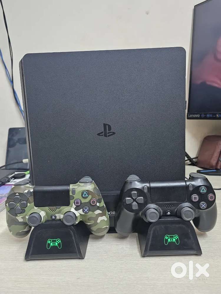 PlayStation 4 Slim 1TB – 2 Controllers + Charging Stand + 3 Top Games