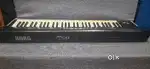 Korg M50 keyboard with stand and memory card.