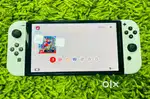 Nintendo switch oled neon and white console