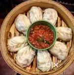 Momo seller with polite behavior and basic money handling from custome