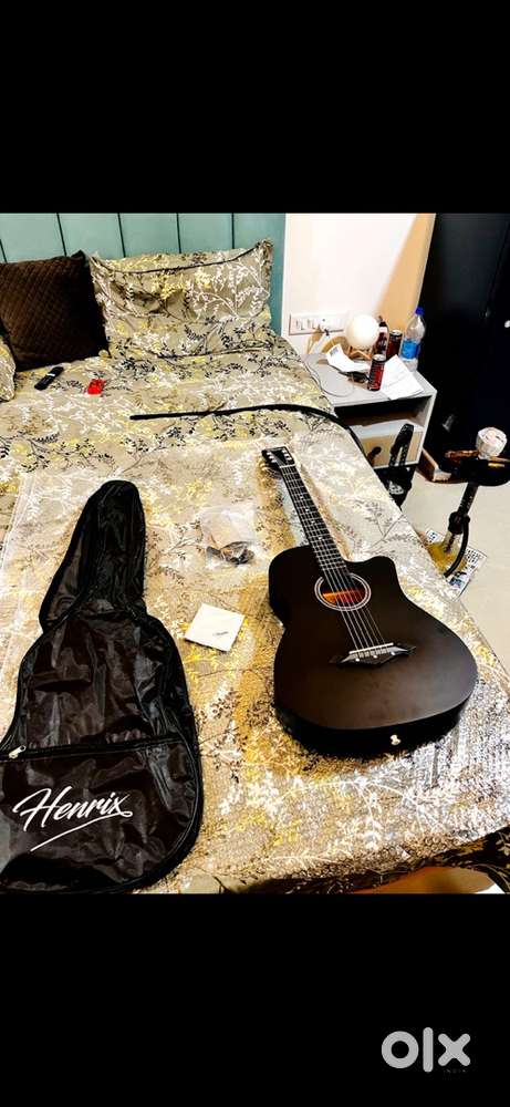 Guitar with cover and other items which came with it.