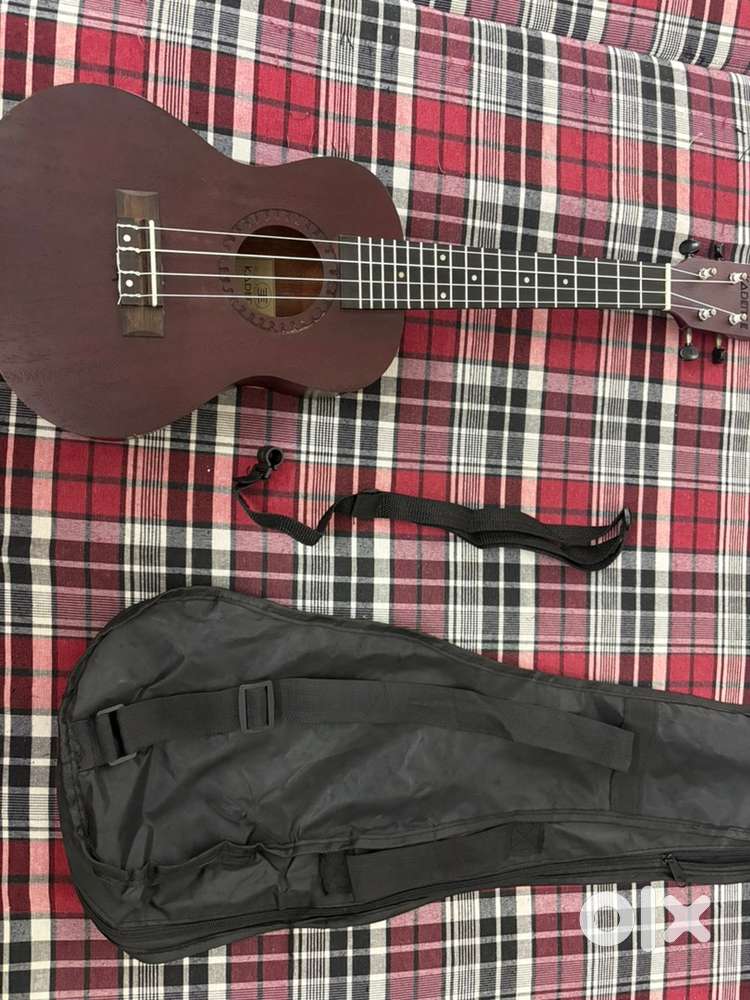 Ukulele - Brand new conditon  with bag and stap