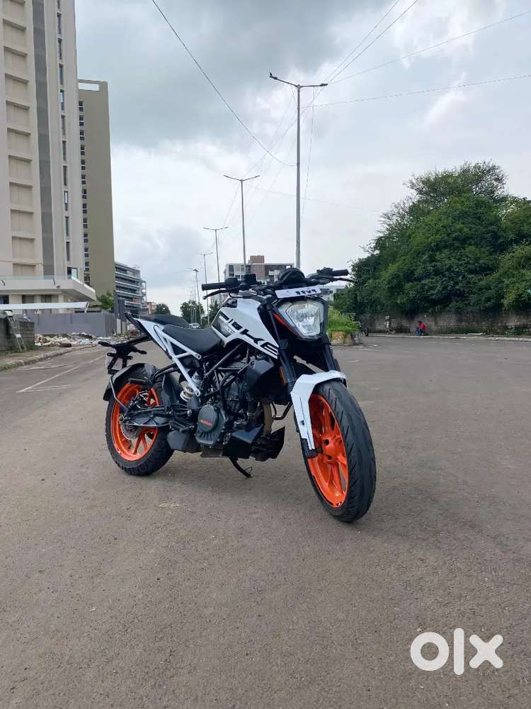 Bike is white orange in colour