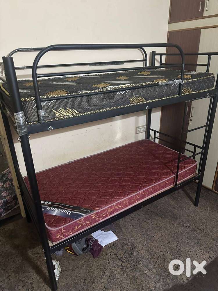 Metal bunk bed with cot