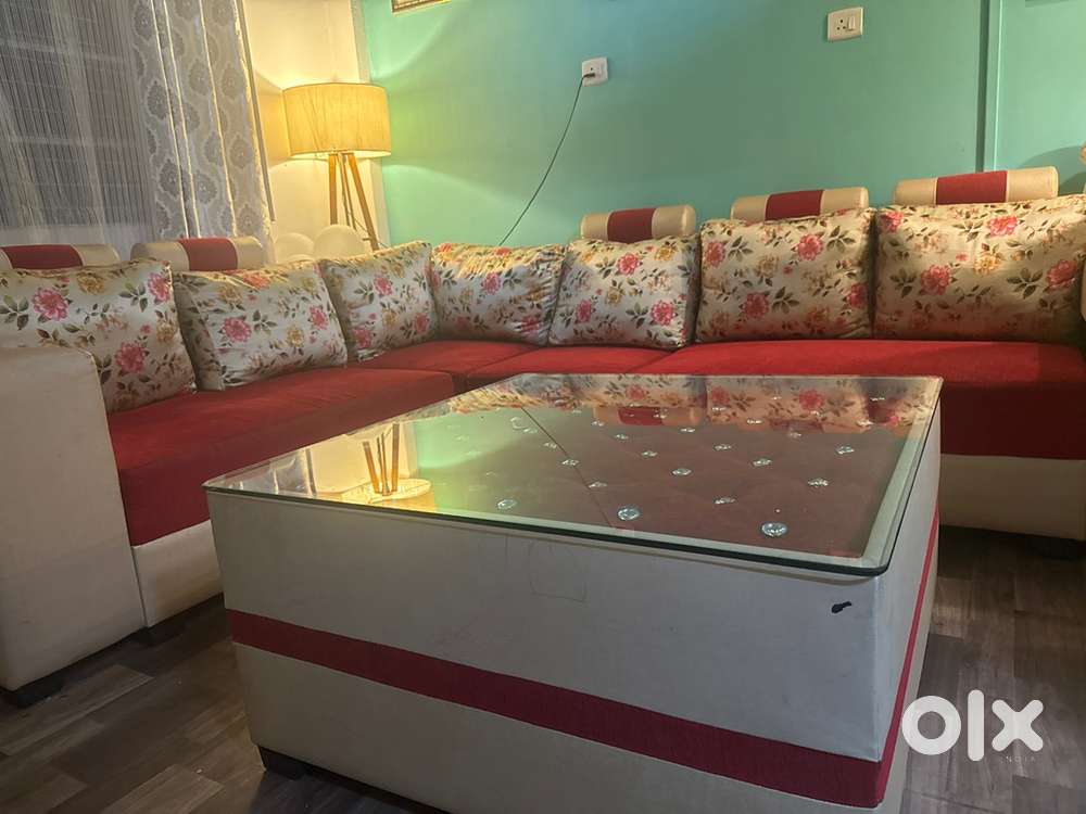 Sofa with cushions and centre table