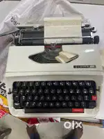 Antique typewriter and Antuque Land line phone
