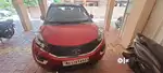 Well maintained Nexon top petrol amt model with dual ton rooftop.