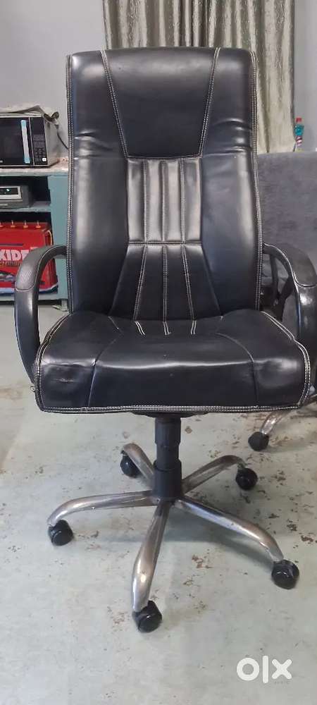 Office chair, revolving chair.