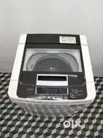 #311099.    LG top load white colour fully automatic washing machine