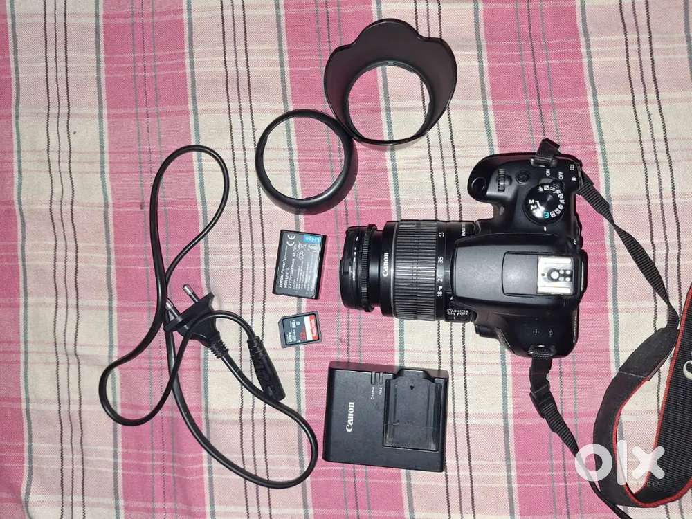 Cannon 1300D body with 18-55 lense and memory card and lense hood