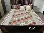King-size bed, with box type storage.