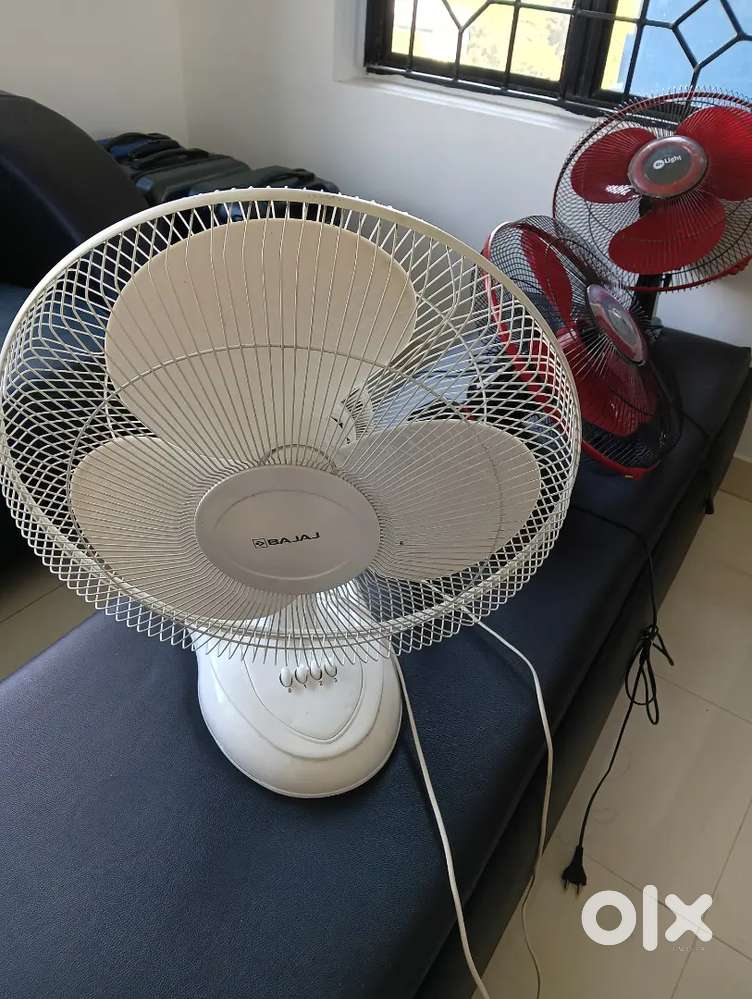 A table fan and 2 wall fans for sale