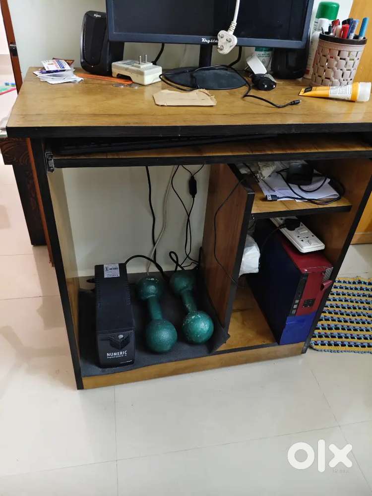 Study table with full of racks and computer table