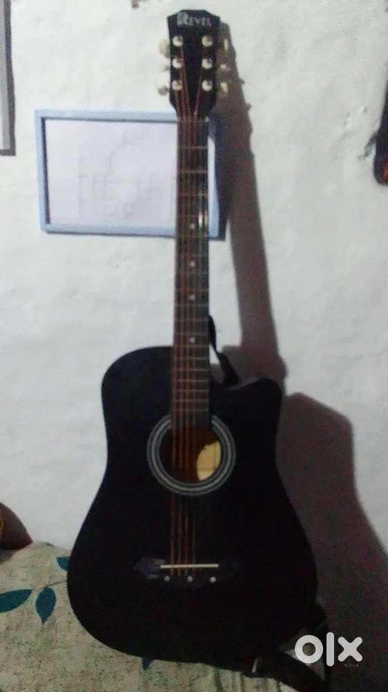Selling a new guitar in best rate mat black colour free accessories..