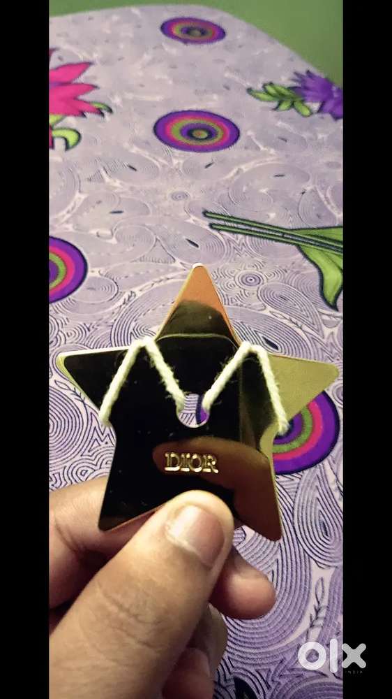Dior star charm gold tone