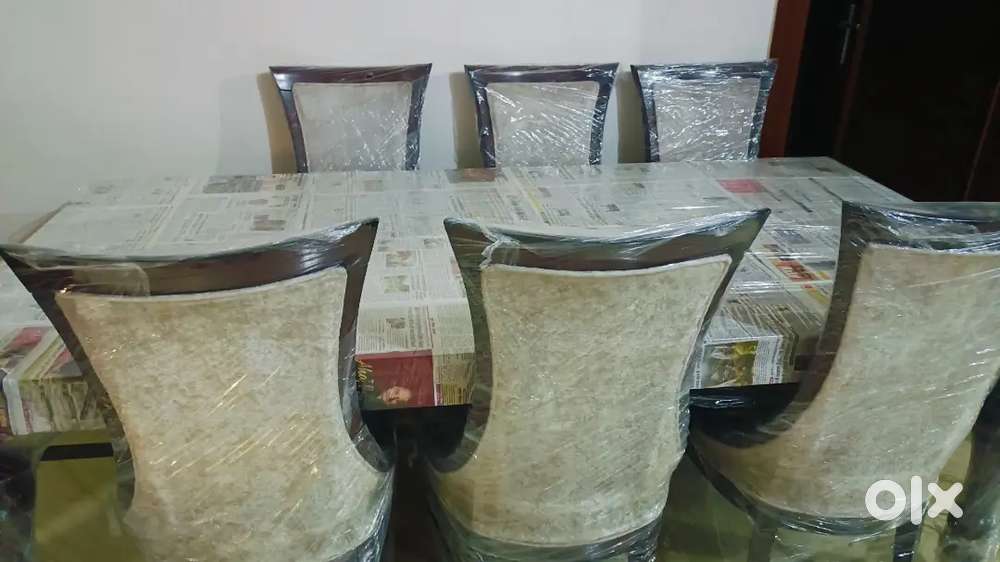 Dinning table with six chairs purchase 550000 just 4 month ago