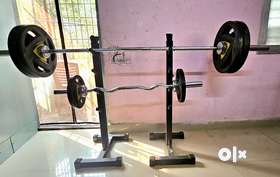 Barbell 50mm  7 feet,Curled Barbell 50mm. 4 feetPlates 05kg x two 50mm ...rubber grippedPlates 10kg ...