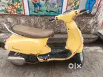 Vespa scooter  yellow colour