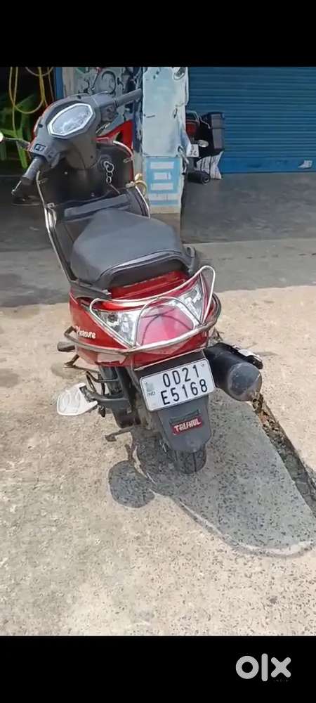 Pleasure scooty in red colour.