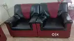A 4-seater leather sofa set is available for sale (2+1+1)