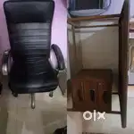 A premium office big black chair and a table